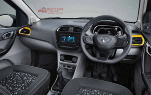 Front view of Tata Tiago 2025 hatchback in red color with LED DRLs