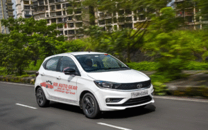 Front view of Tata Tiago 2025 hatchback in red color with LED DRLs