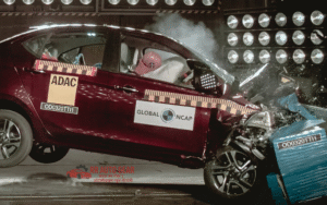 Front view of Tata Tiago 2025 hatchback in red color with LED DRLs